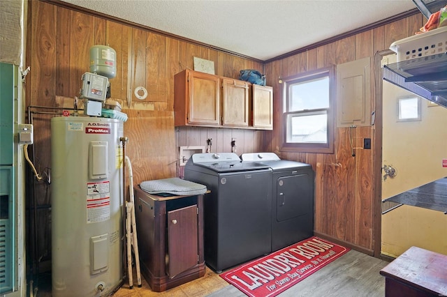 23425 N Everett Carr Rd, Mo, MO 65243 - laundry room with electric water heater, independent washer and dryer, cabinet space, wooden walls, and light wood-style flooring