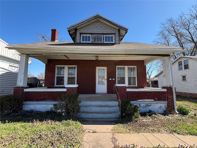 3345 Belle St, Alton, IL 62002 - view of front of home with covered porch, brick siding, a shingled roof, and a chimney