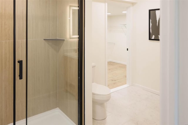 407 Front St, Monroe City, MO 63456 - bathroom with toilet, a stall shower, and baseboards