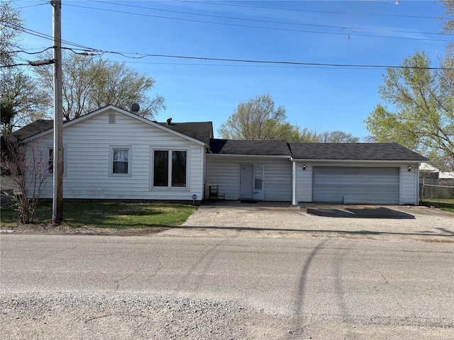861 Pershing Blvd E, St Louis, IL 62203 - single story home with an attached garage, driveway, and a shingled roof