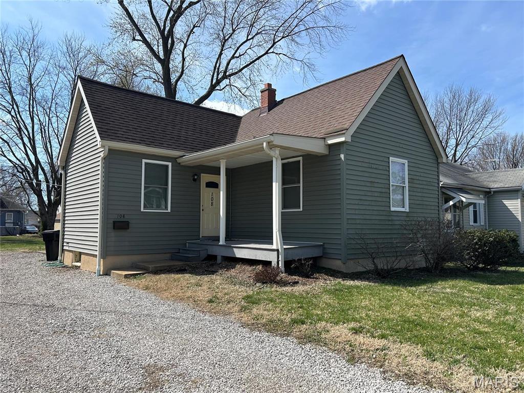 108 S 35th St, Belleville, IL 62226 - view of front of house with a chimney, a shingled roof, a porch, and a front yard