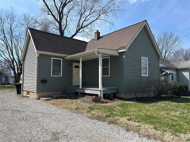 108 S 35th St, Belleville, IL 62226 - view of front of house with a chimney, a shingled roof, a porch, and a front yard
