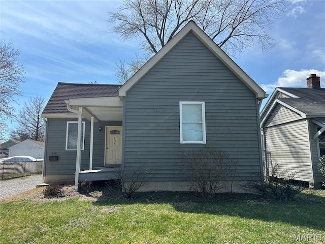 108 S 35th St, Belleville, IL 62226 - view of front facade featuring a front lawn, roof with shingles, and covered porch