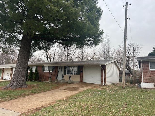 10314 Viscount Dr, Saint Louis, MO 63136 - view of front facade featuring a garage, brick siding, a front lawn, and driveway