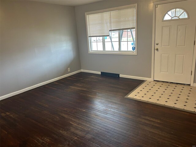 10314 Viscount Dr, Saint Louis, MO 63136 - foyer entrance with healthy amount of natural light, baseboards, and wood-type flooring