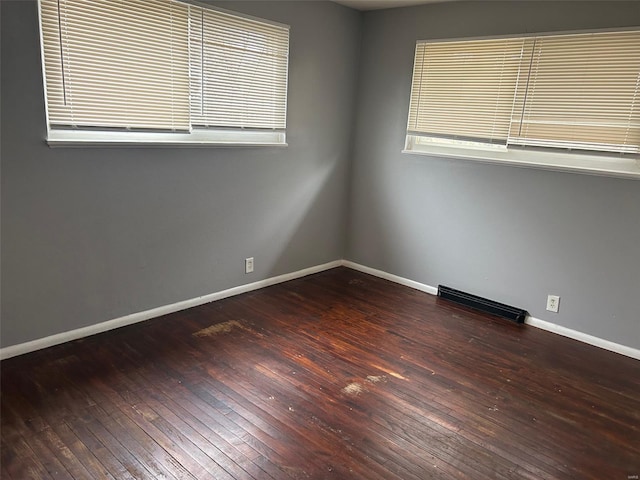 10314 Viscount Dr, Saint Louis, MO 63136 - unfurnished room featuring hardwood / wood-style flooring, baseboards, and healthy amount of natural light