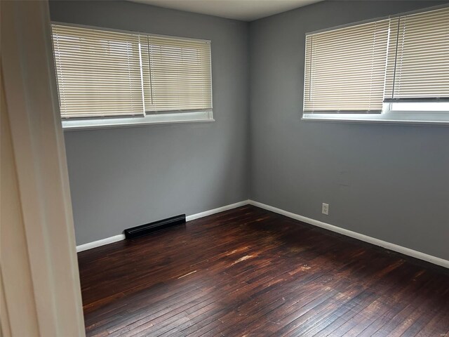 10314 Viscount Dr, Saint Louis, MO 63136 - spare room featuring hardwood / wood-style floors, baseboards, and plenty of natural light