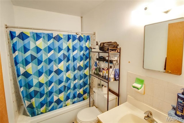 bathroom featuring shower / bathtub combination with curtain, toilet, and vanity