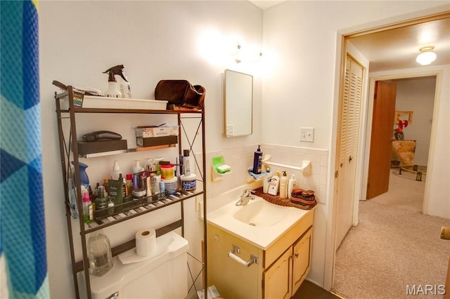 bathroom featuring vanity and toilet