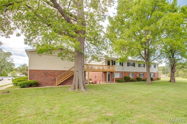 5310 Godfrey Rd Unit 2, Godfrey, IL 62035 - rear view of property featuring brick siding, stairs, a lawn, and a wooden deck