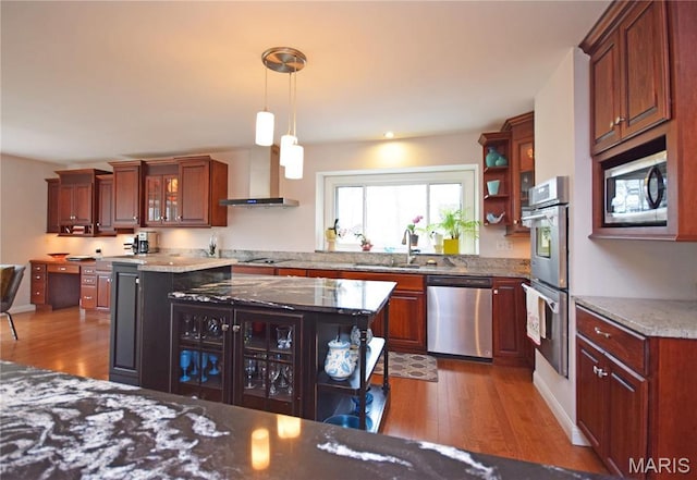 kitchen with stainless steel appliances, wood finished floors, a sink, and open shelves