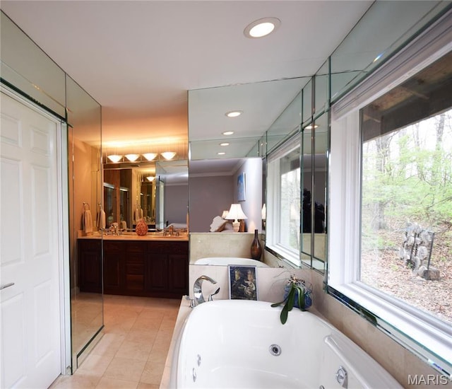 full bathroom featuring a tub with jets, vanity, tile patterned flooring, and recessed lighting