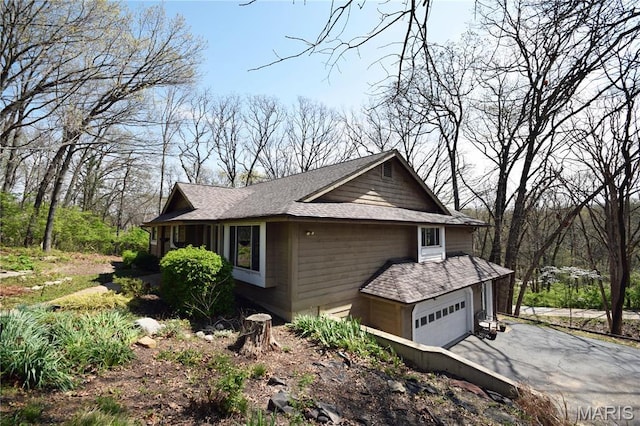 view of side of property with driveway