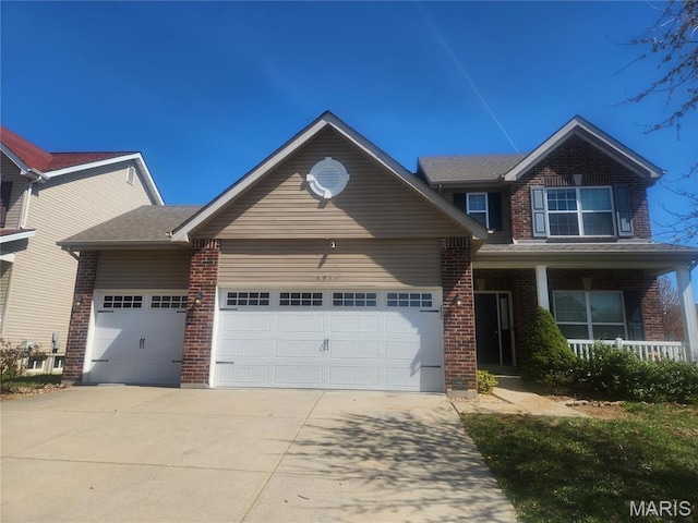 1914 Teresa Fields Ln, Lake St Louis, MO 63367 - view of front of home with an attached garage, driveway, brick siding, and a porch