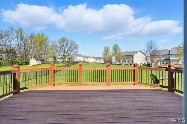 1914 Teresa Fields Ln, Lake St Louis, MO 63367 - deck with a residential view, a storage shed, an outdoor structure, and a lawn