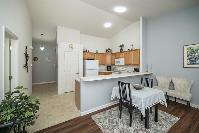 173 Silo View Dr Unit 393A, Wentzville, MO 63385 - kitchen with white appliances, a peninsula, light countertops, high vaulted ceiling, and baseboards