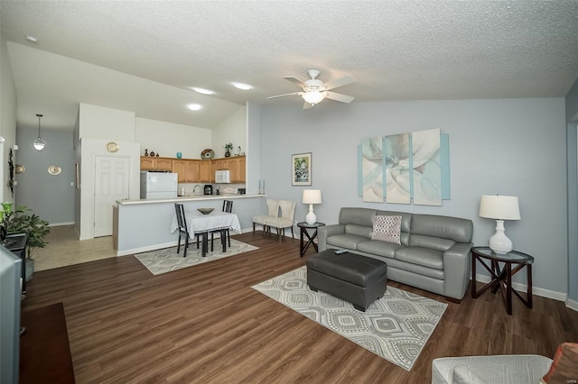 173 Silo View Dr Unit 393A, Wentzville, MO 63385 - living area featuring lofted ceiling, ceiling fan, a textured ceiling, baseboards, and wood finished floors