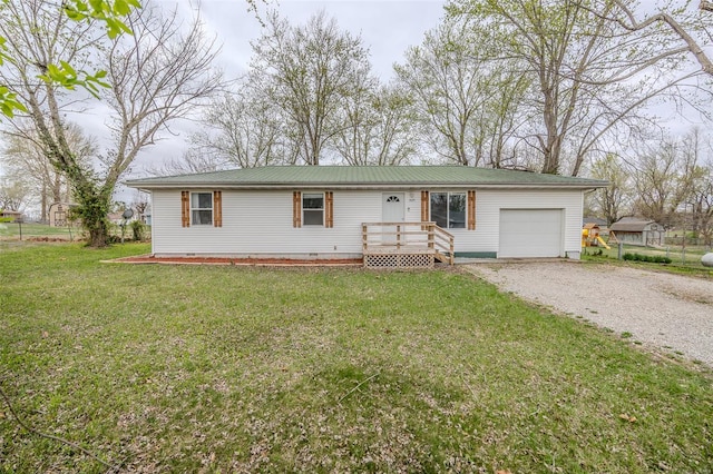 1425 Cedar Dr, Lebanon, MO 65536 - single story home featuring a garage, driveway, a front lawn, crawl space, and metal roof