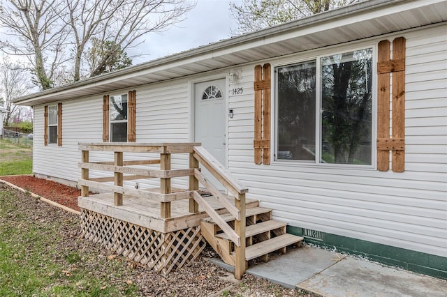 1425 Cedar Dr, Lebanon, MO 65536 - property entrance with crawl space and a wooden deck