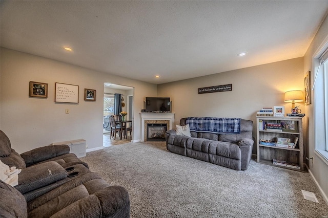 1425 Cedar Dr, Lebanon, MO 65536 - carpeted living room featuring baseboards, recessed lighting, and a glass covered fireplace