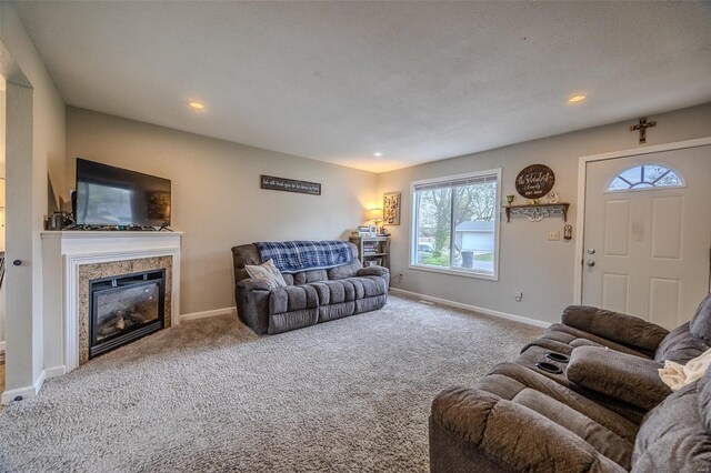1425 Cedar Dr, Lebanon, MO 65536 - living room featuring baseboards, healthy amount of natural light, a glass covered fireplace, and recessed lighting