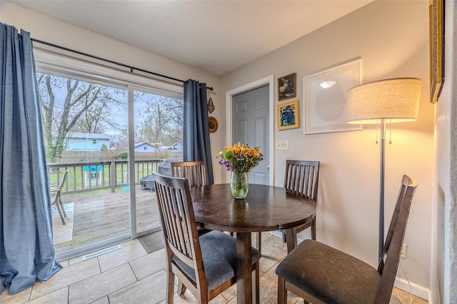 1425 Cedar Dr, Lebanon, MO 65536 - dining space featuring light tile patterned floors