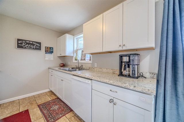 1425 Cedar Dr, Lebanon, MO 65536 - kitchen with white dishwasher, a sink, baseboards, light countertops, and white cabinets
