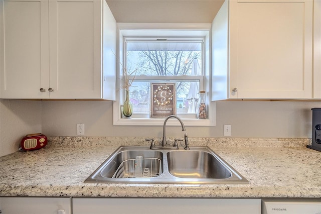 1425 Cedar Dr, Lebanon, MO 65536 - kitchen with a sink, light countertops, and white cabinetry