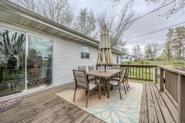 1425 Cedar Dr, Lebanon, MO 65536 - wooden deck featuring outdoor dining area