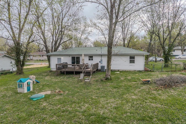 1425 Cedar Dr, Lebanon, MO 65536 - rear view of property with a deck and metal roof