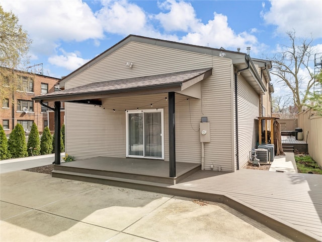 5089 Waterman Blvd, Saint Louis, MO 63108 - rear view of property with a deck and central air condition unit