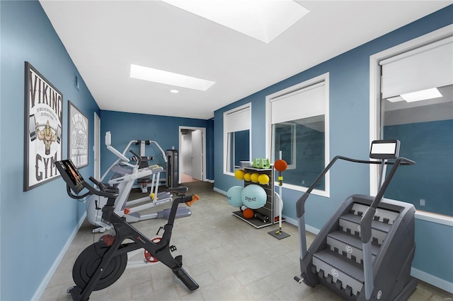 5089 Waterman Blvd, Saint Louis, MO 63108 - workout room with a skylight and baseboards