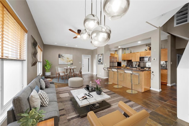 5089 Waterman Blvd, Saint Louis, MO 63108 - living area with baseboards, ceiling fan, and recessed lighting
