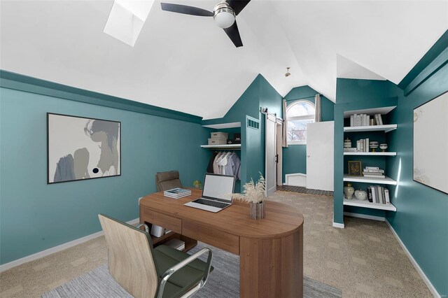 5089 Waterman Blvd, Saint Louis, MO 63108 - carpeted home office with ceiling fan, lofted ceiling, a skylight, and baseboards