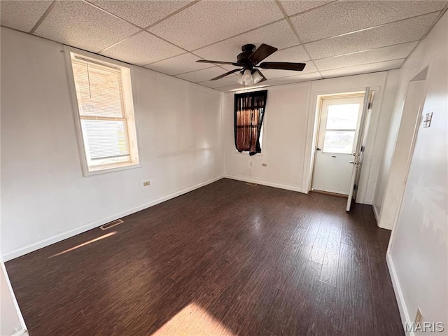 1001 S Central Ave, Vandalia, MO 63382 - unfurnished room featuring a drop ceiling, wood finished floors, ceiling fan, and baseboards