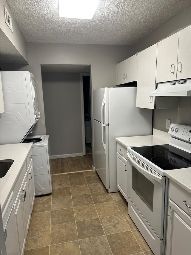 1459 Bobolink Pl, Saint Louis, MO 63144 - kitchen featuring white appliances, under cabinet range hood, light countertops, a textured ceiling, and white cabinets