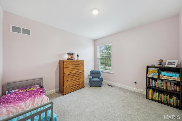 bedroom featuring carpet floors and baseboards