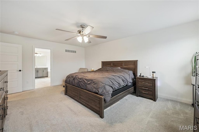 carpeted bedroom with baseboards, a ceiling fan, and connected bathroom