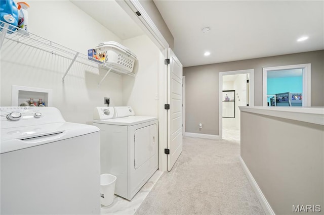 laundry area featuring independent washer and dryer, recessed lighting, light carpet, and baseboards