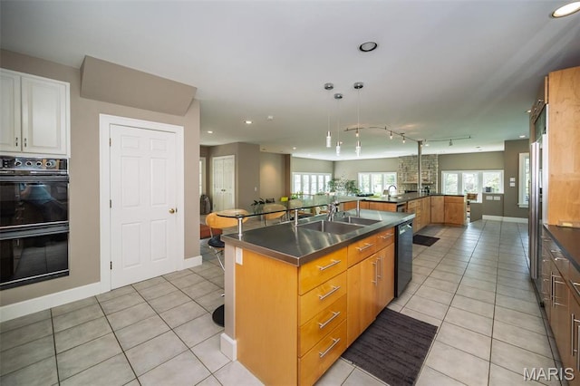 1211 S Geyer Rd, Saint Louis, MO 63122 - kitchen featuring stainless steel countertops, a sink, light tile patterned flooring, dishwashing machine, and recessed lighting