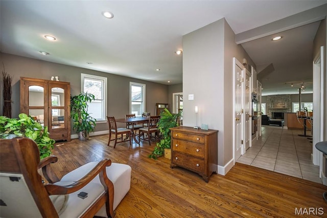 1211 S Geyer Rd, Saint Louis, MO 63122 - entrance foyer with wood finished floors, baseboards, recessed lighting, and a fireplace