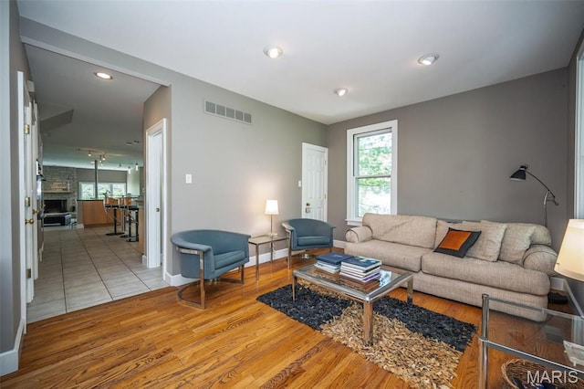 1211 S Geyer Rd, Saint Louis, MO 63122 - living area with wood finished floors, baseboards, and recessed lighting