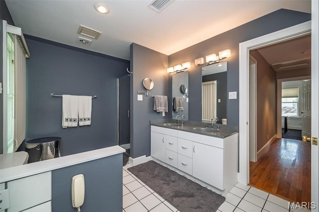 1211 S Geyer Rd, Saint Louis, MO 63122 - full bathroom featuring double vanity, tile patterned flooring, baseboards, and a shower