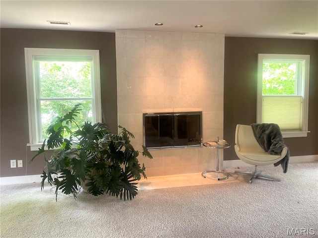 1211 S Geyer Rd, Saint Louis, MO 63122 - carpeted living area with a tiled fireplace