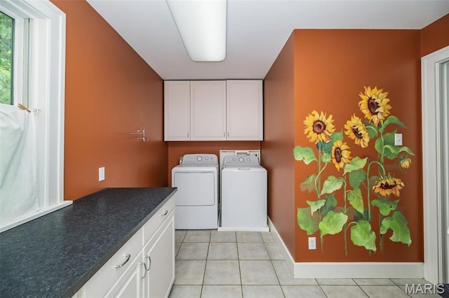 1211 S Geyer Rd, Saint Louis, MO 63122 - laundry area featuring cabinet space, washing machine and clothes dryer, light tile patterned flooring, and baseboards