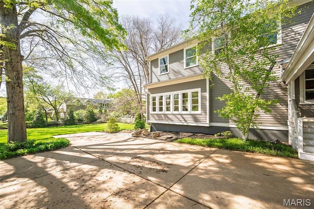 1211 S Geyer Rd, Saint Louis, MO 63122 - rear view of house with a patio and a lawn