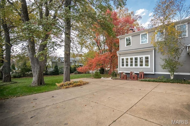 1211 S Geyer Rd, Saint Louis, MO 63122 - view of property exterior with a chimney, a patio, and a yard