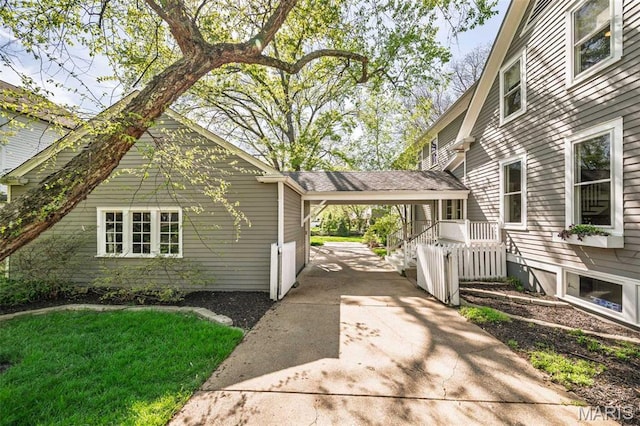 1211 S Geyer Rd, Saint Louis, MO 63122 - view of home's exterior with an attached carport, concrete driveway, and a lawn