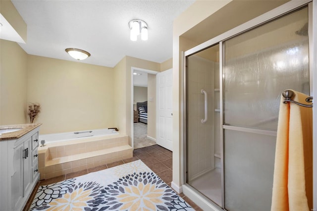 full bath featuring a shower stall, tile patterned floors, a bath, and vanity