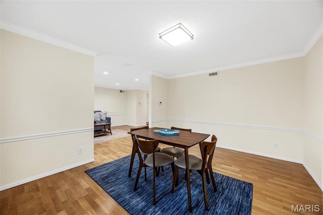 15038 Claymoor Ct Unit 2, Chesterfield, MO 63017 - dining space with wood finished floors, baseboards, ornamental molding, and recessed lighting